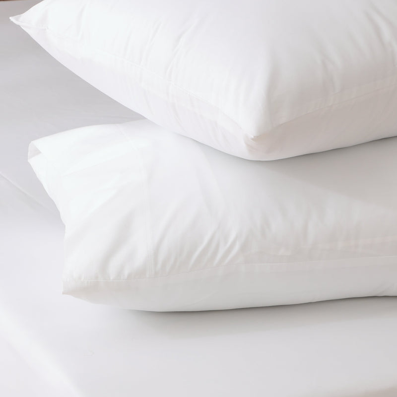 two organic cotton fitted sheet set count pillowcases in 250TC on a fitted sheet white. Whites of London. Australia. 