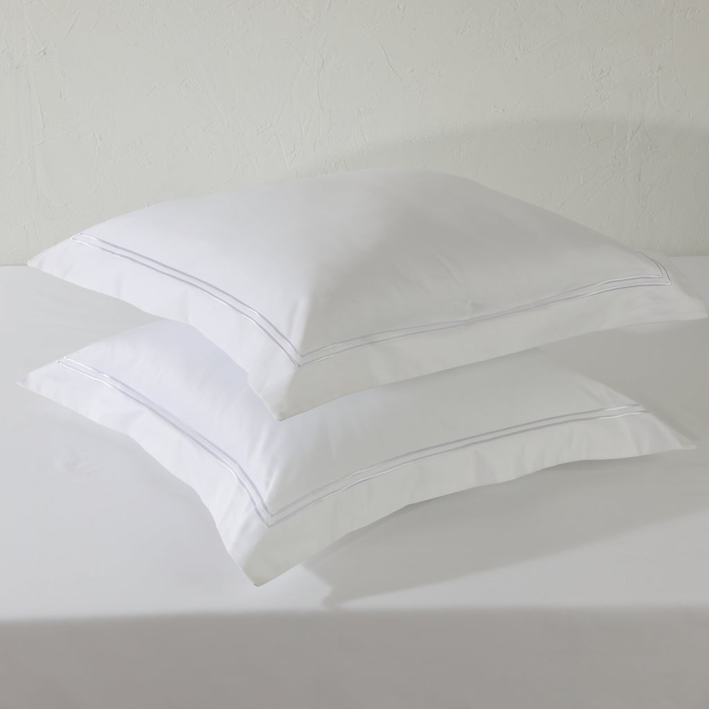 Two white euro GOTS certified organic cotton pillowcase stacked, showing cord embroidery detail in  1250TC 