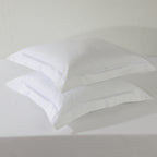 Two white euro GOTS certified organic cotton pillowcase stacked, showing cord embroidery detail in  1250TC 