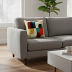 Whites of London Vertex Decorative Cushion – geometric abstract multicolour crewel embroidery on grey sofa NZ