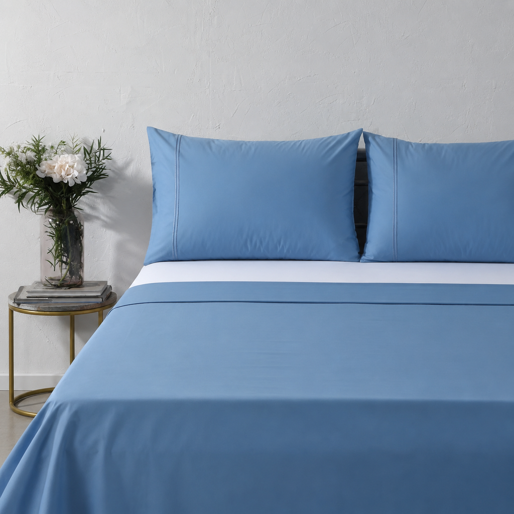 Whites of London 250TC GOTS certified Organic Cotton Coloured Sheet Set Blue Mirage – with embroidered trim luxury bed linen NZ styled with 250TC GOTS certified organic cotton fitted sheet