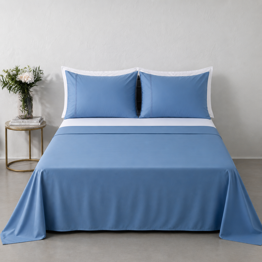 Blue Mirage 250TC GOTS certified organic cotton sheet set by Whites of London NZ. Styled with white organic GOTS certified cotton white fitted sheet and pillow cases