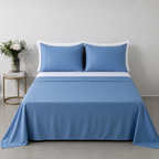 Blue Mirage 250TC GOTS certified organic cotton sheet set by Whites of London NZ. Styled with white organic GOTS certified cotton white fitted sheet and pillow cases