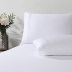 Close up of pillowcase with triple cord embroidery: 1250TC GOTS certified Organic Cotton Sheet Set white pillowcase flat sheet detail and Organic Cotton Fitted Sheet Whites of London 