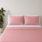 Dusty Pink 250TC GOTS certified organic cotton sheet set. Styled with white organic GOTS certified cotton fitted sheet. 