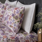 Pillow cases of the Whites of London NZ Organic Cotton Percale Printed Sheet Set Flutter 250TC  styled with white pillowcases behind it 