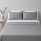 Greystone 250TC certified organic cotton sheet set styled with fitted sheet and white pillowcases