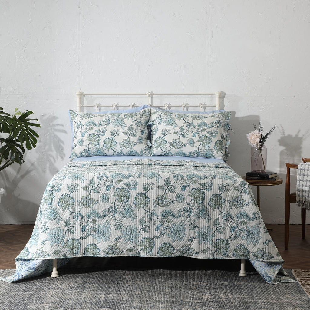 Full bed front view of Jacobean Windflower Percale Reversible Quilt Set on styled bedroom bed, Whites of London