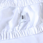 100% linen fitted sheet with visible brand label.