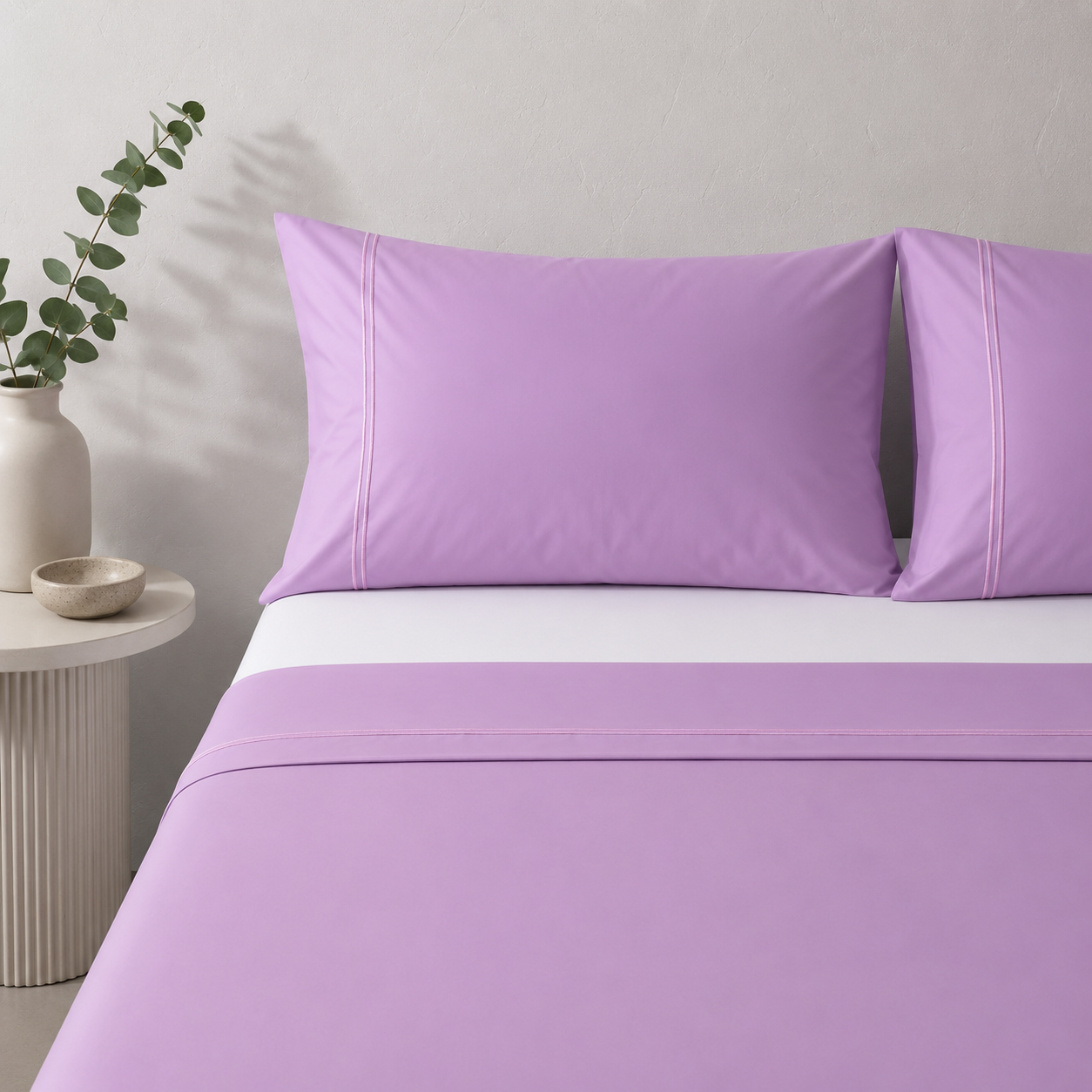 Whites of London 250TC GOTS certified Organic Cotton Coloured Sheet Set – Orchid – tonal lilac double embroidered stripe detail styled with 250TC white Organic cotton fitted sheet 