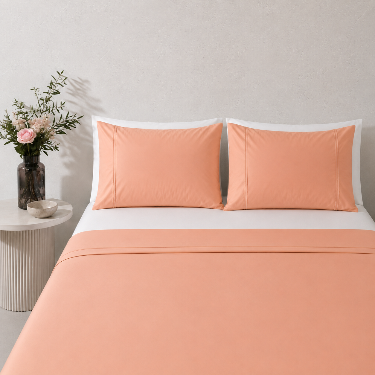Peach nectar 250TC GOTS certified organic cotton sheet set. Styled with white organic GOTS certified cotton fitted sheet. 
