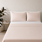 Peach mist 250TC GOTS certified organic cotton sheet set. Styled with white organic GOTS certified cotton fitted sheet. 