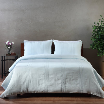 Whites of London glacier blue pure linen duvet cover set styled on a bed. New Zealand and Australia.European French flax