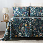 Left side view of Adriana Blue 250TC GOTS certified organic cotton percale printed sheet set on bed, highlighting blue floral print and delicate leafy details