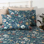 Front view of Adriana Blue 250TC GOTS certified organic cotton percale printed sheet set with matching pillowcases displayed on bed, soft blue floral design