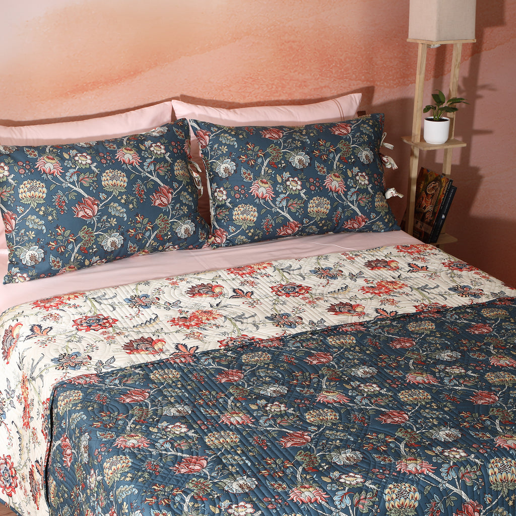 Percale Reversible Quilt Set showing reverse side in Chintz Percale on styled bed teal and cream jacobean floral Whites of London