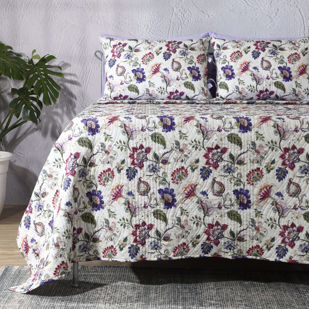 Left side view of Lavender Fields percale reversible quilt set with pillowcases, highlighting reversible design and floral details