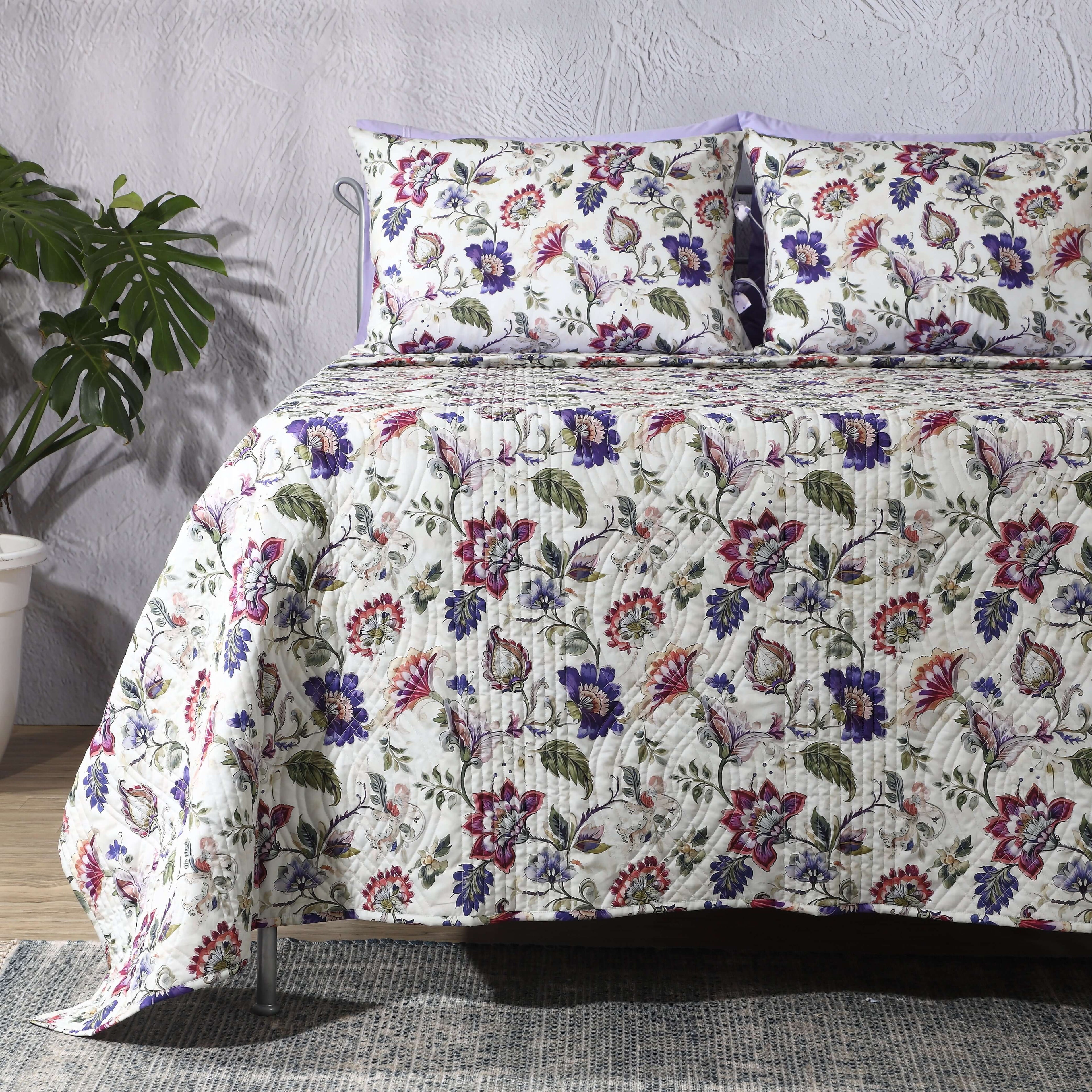 Left side view of Lavender Fields percale reversible quilt set with pillowcases, highlighting reversible design and floral details