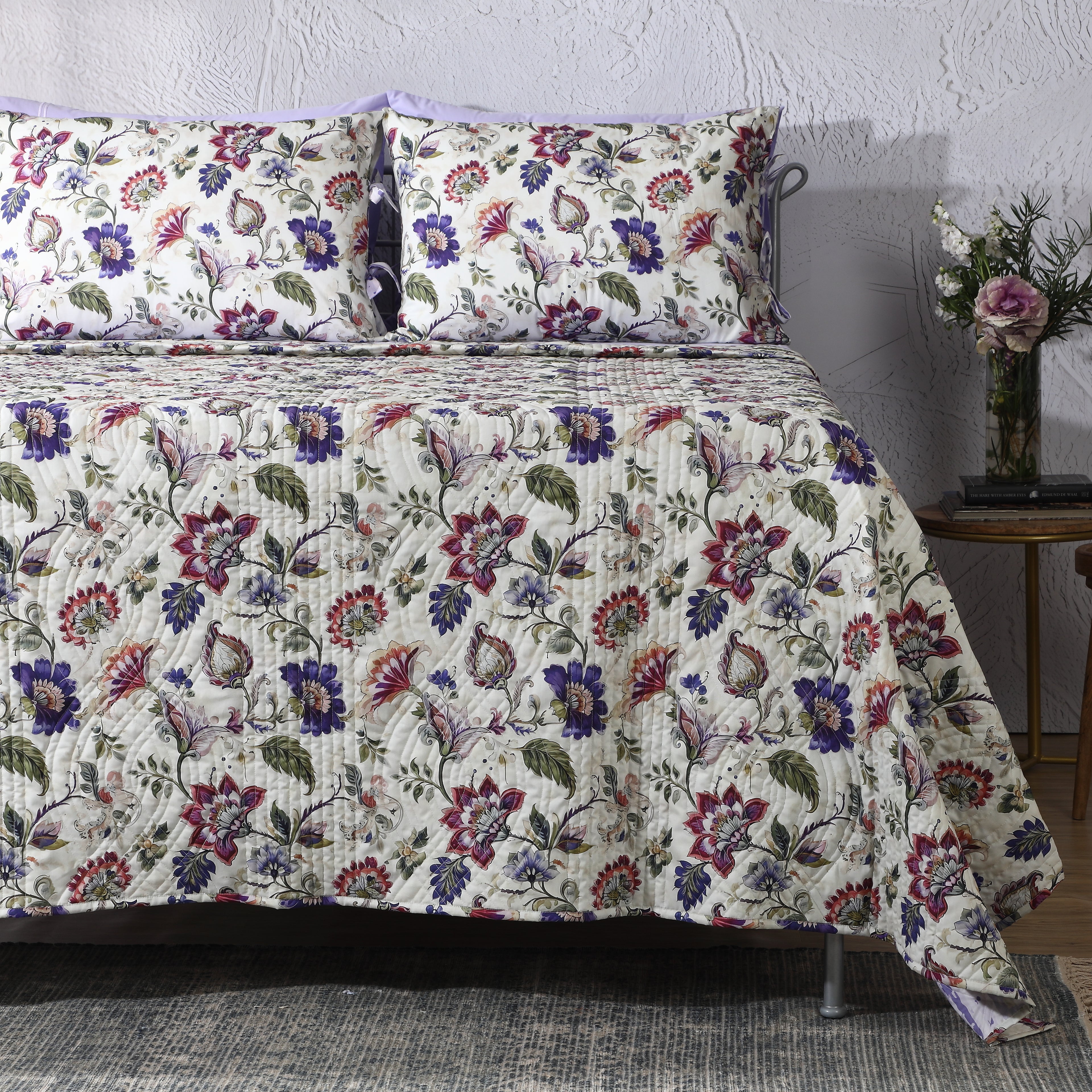 Right side view of Lavender Fields percale reversible quilt set with pillowcases, showing reversible design and lavender floral print