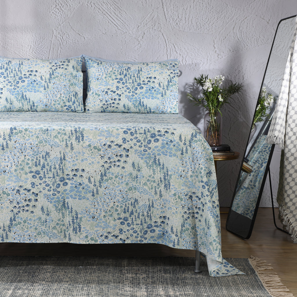 Full bed view of Windflower 250TC GOTS certified organic cotton percale printed sheet set in blue, sage and ivory