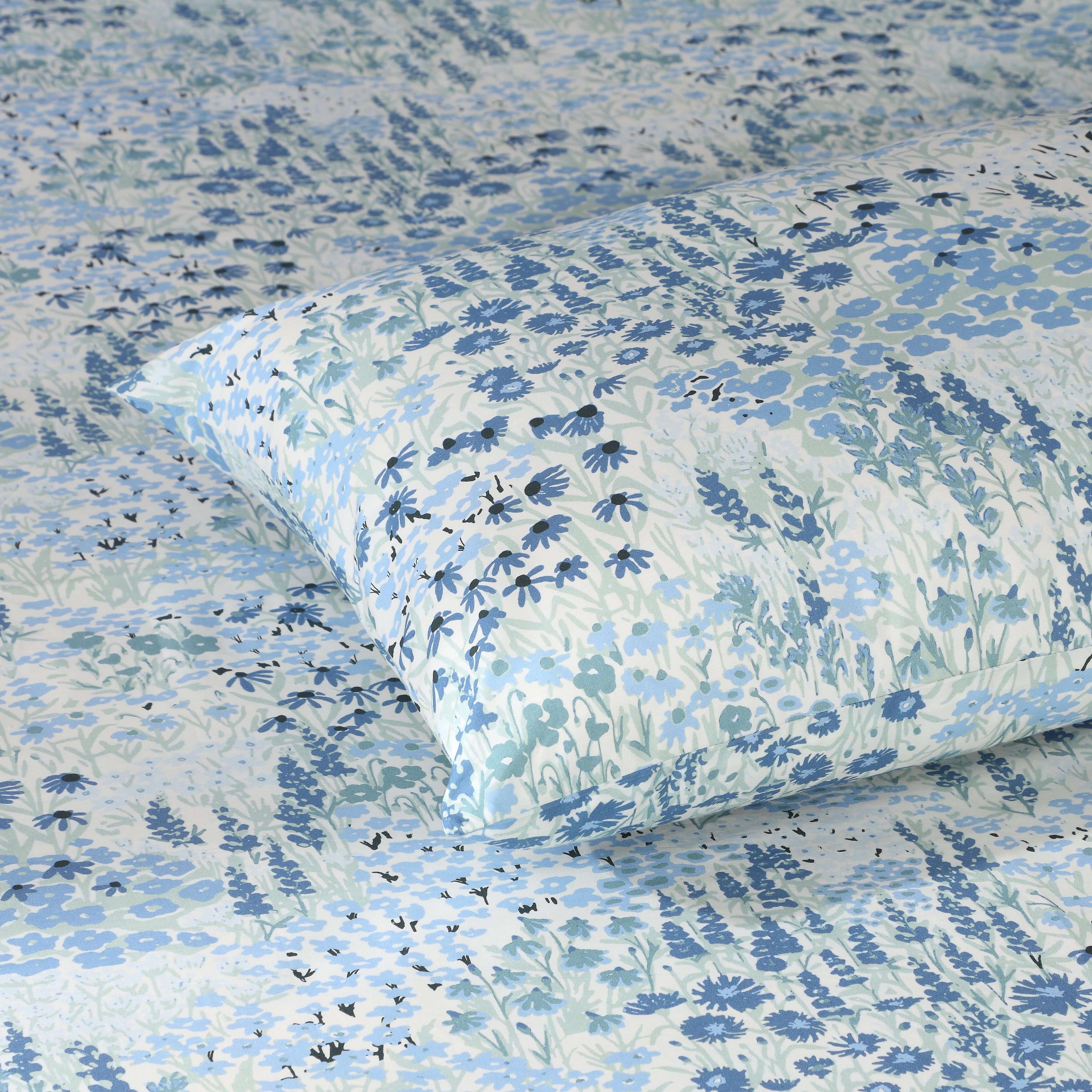 Extreme close-up of Windflower blue wildflower print, part of 250TC  GOTS certified organic cotton percale printed sheet set