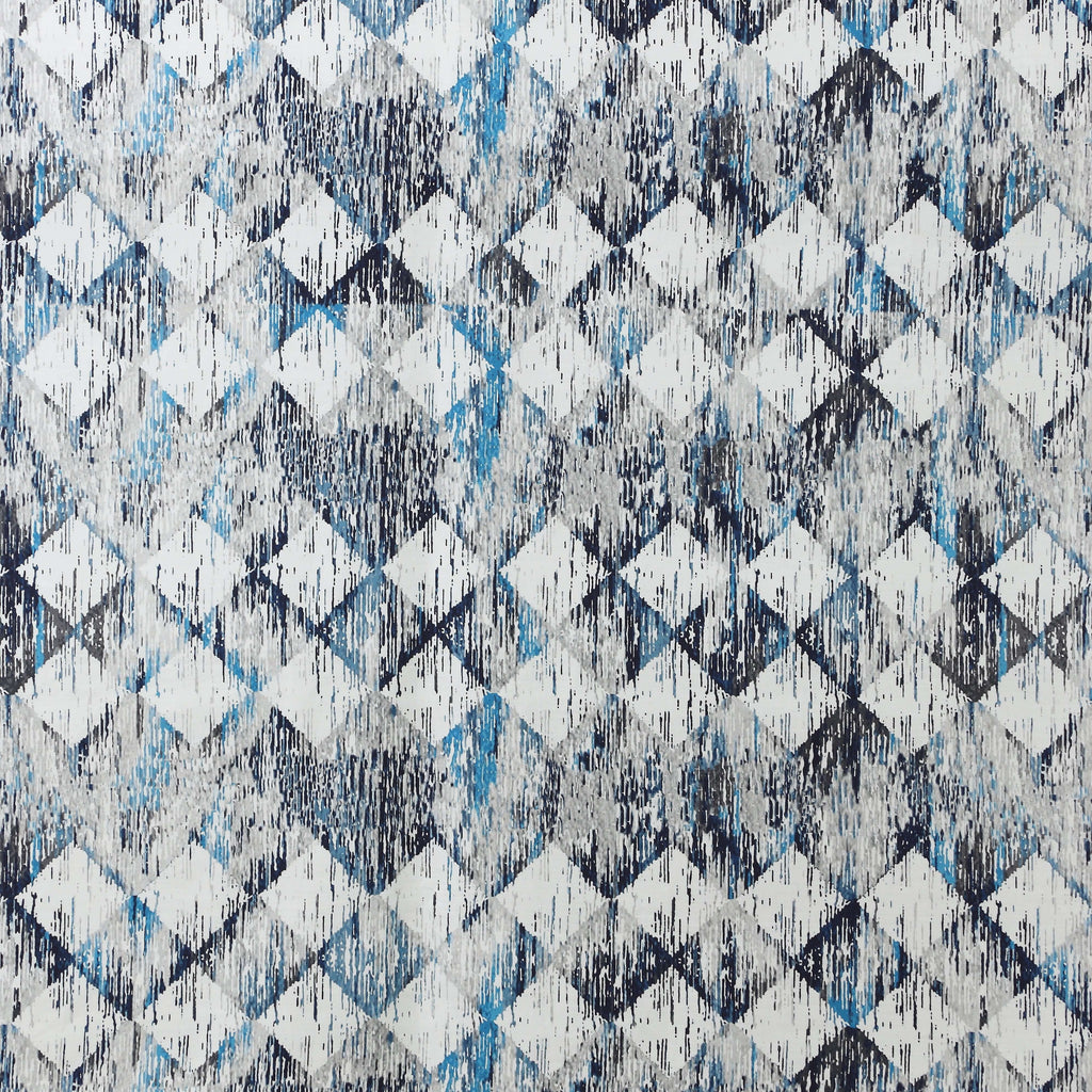 Close-up of Flint 250TC GOTS certified organic cotton percale printed sheet set showing geometric blue, slate, and grey design detail