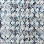 Close-up of Flint 250TC GOTS certified organic cotton percale printed sheet set showing geometric blue, slate, and grey design detail