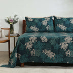 Left-side view of Hydrangea teal pillowcases on bed, part of 250TC GOTS certified organic cotton percale printed sheet set