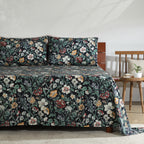 Right side view of Adriana Black 250TC GOTS certified organic cotton percale printed sheet set on bed, showing black floral pattern with layered blooms and leafy details