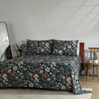 Wide view of bedroom featuring Adriana Black 250TC GOTS certified organic cotton percale printed sheet set on bed, black floral print with coordinating pillows and styled décor