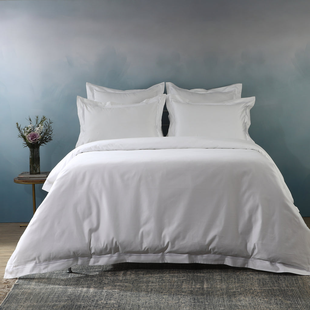 Luxury bedroom lifestyle shot with white euro pillowcases and matching duvet cover, part of 1250TC euro GOTS certified organic cotton pillowcase
