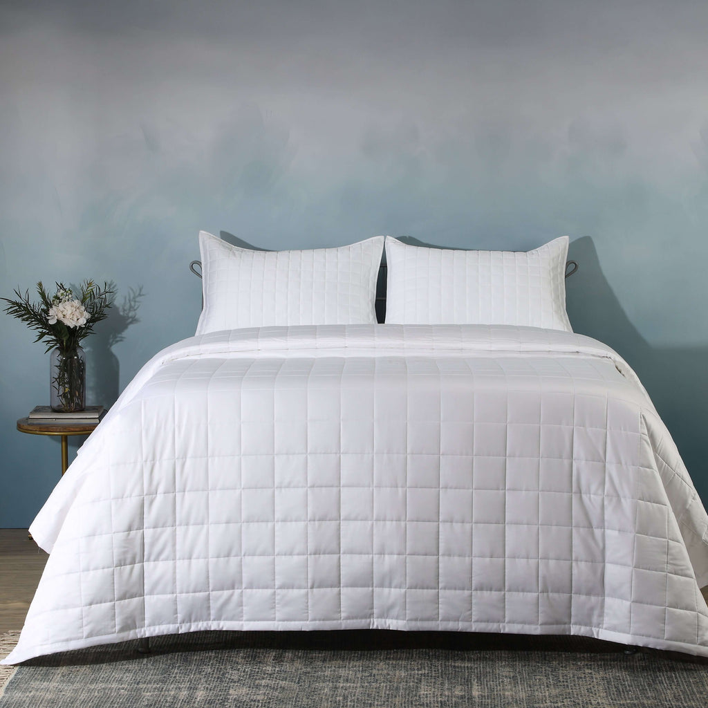 Full bed front on with white quilted bedspread and side table: White bamboo cotton bedspread set quilted square pattern full bed Whites of London NZ