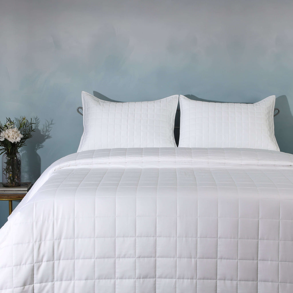 Clean front on full bed shot with teal wall background: White bamboo cotton bedspread set quilted square design full bed teal wall Whites of London