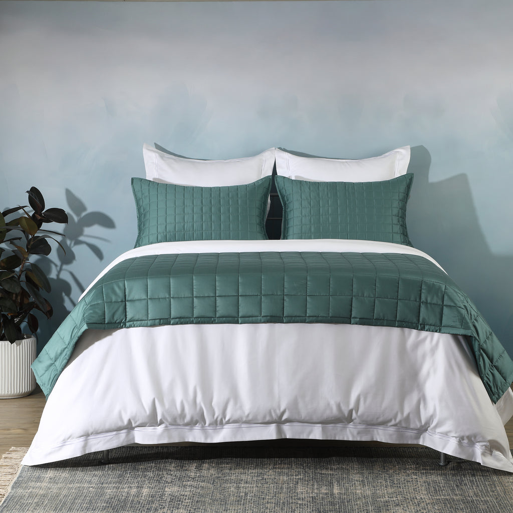 Teal bedspread layered over white duvet cover styled bed: Teal bamboo cotton bedspread set layered over white duvet cover bedroom styling Whites of London