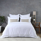 Luxury bedroom lifestyle shot with white euro pillowcases and matching duvet cover, part of 750TC GOTS certified organic cotton pillowcases