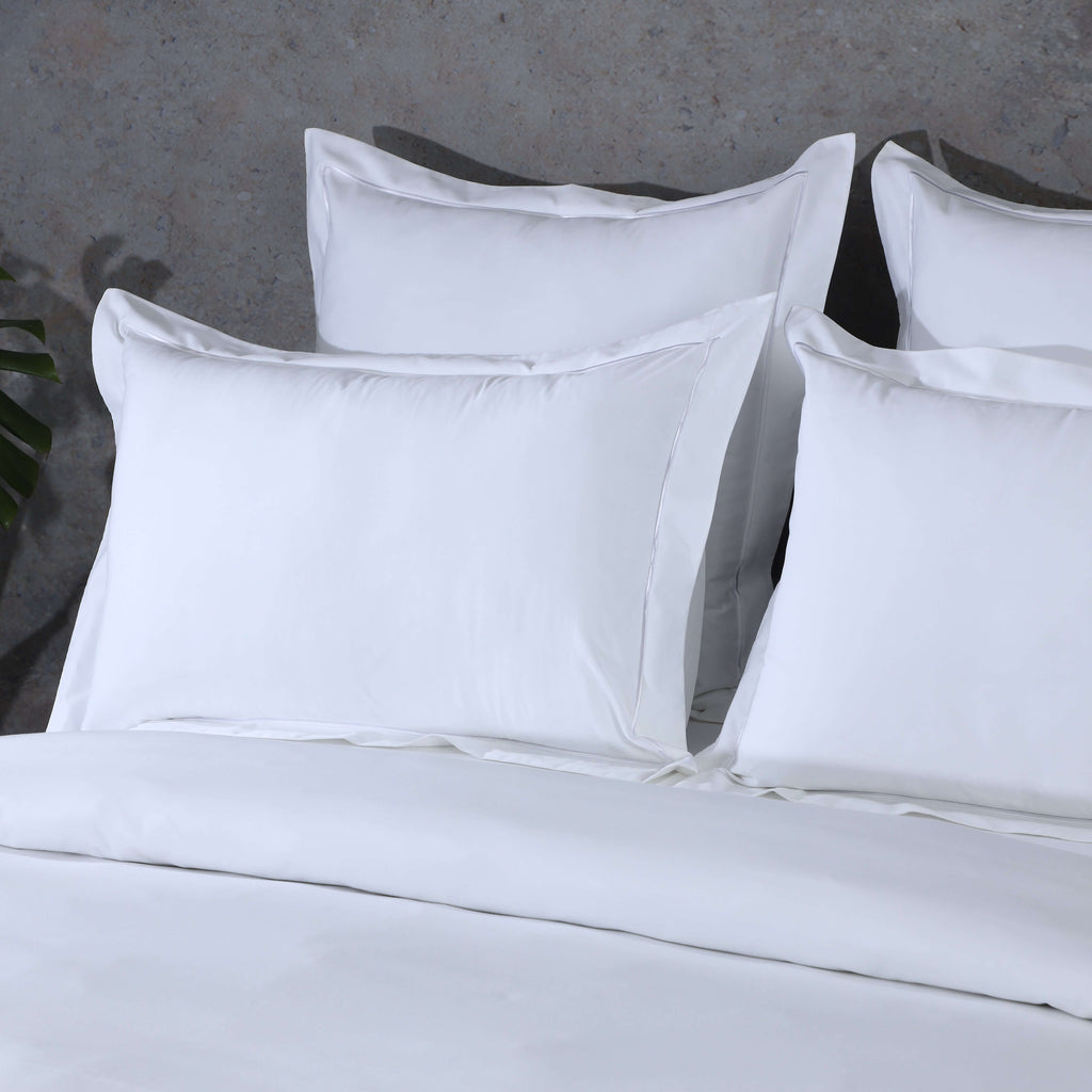 Whites of London stacked euro GOTS certified organic cotton pillowcase sets on a bed , in white 750TC, New Zealand and Australia 