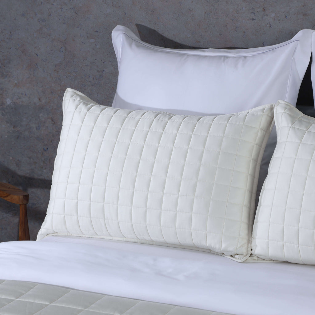 Close-up of ivory pillowcases from Bamboo Cotton Bedspread Set showing quilted square pattern layered with white pillowcase, Whites of London NZ 