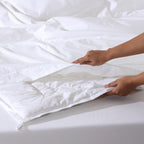 Whites of London Bamboo & Recycled Polyester Duvet Filler – being inserted into duvet cover New Zealand