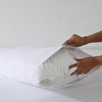 Whites of London Bamboo & Recycled Polyester Pillow Filler 50x75 being inserted into pillowcase Australia