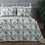 Organic cotton percale printed sheet set featuring a floral design in terracotta and teal tones.