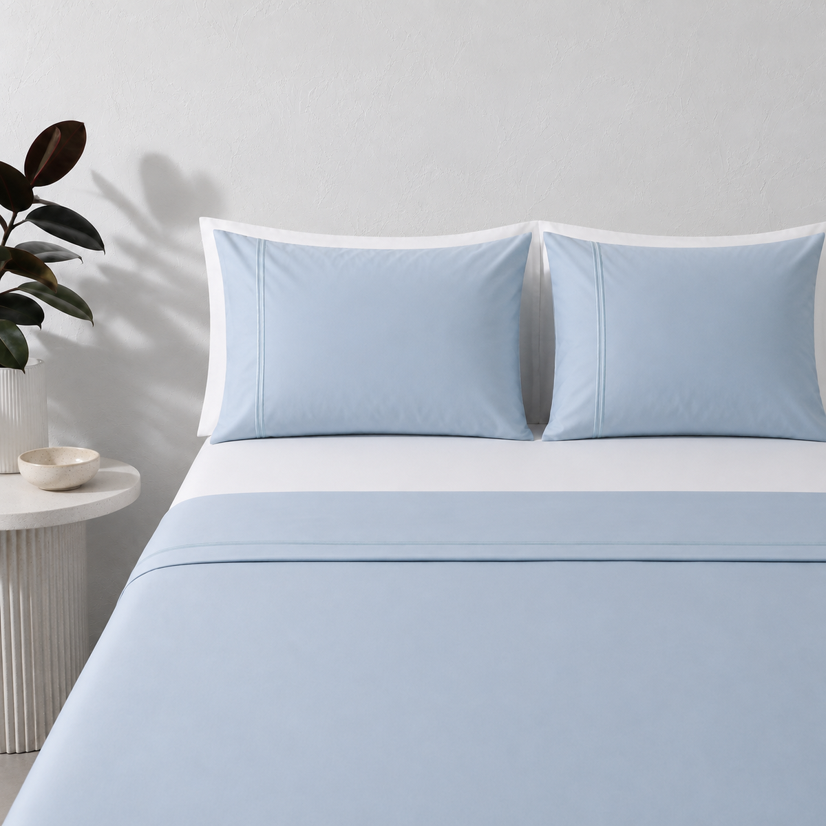 Sky 250TC GOTS certified organic cotton sheet set by Whites of London NZ. Styled with white organic GOTS certified cotton white fitted sheet and pillow cases