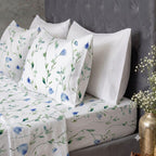 Matching pillow cases styled with matching fitted sheet and white pillow cases of the Whites of London NZ Organic Cotton Percale Printed Sheet Set 250TC Watercolour mist